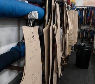 Garment patterns hanging in the workshop